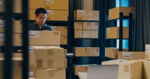 Resources 6 Man in room full of boxes