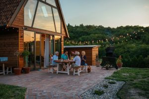 family gathering together at backyard wooden table 2026 03 09 22 08 03 web