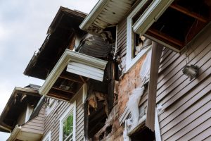 exterior damage on a two story suburban house 2026 03 25 00 38 03 web